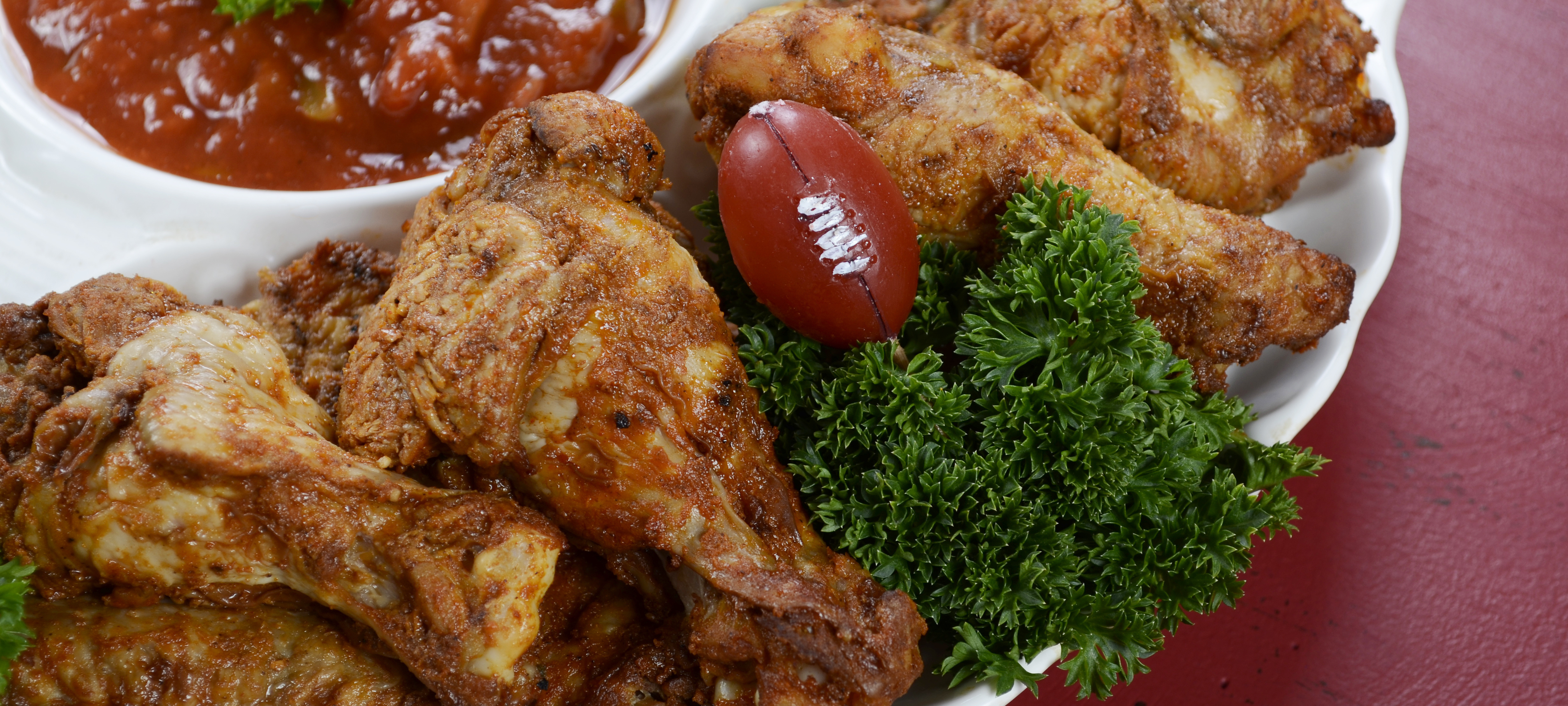 Sports bars should package chicken wings for NCAA Bowl Season tailgate menus.