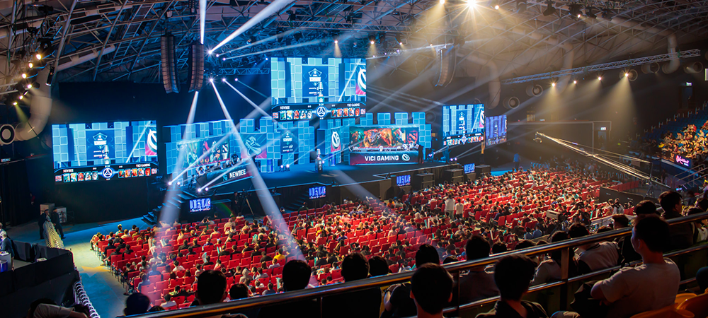 Image of a live esports tournament event with a huge crowd