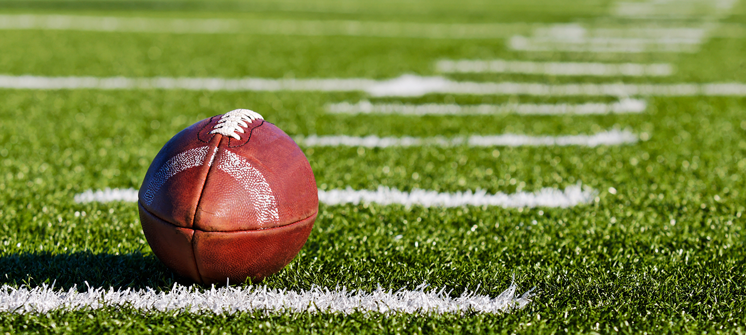 Closeup of a football on a field