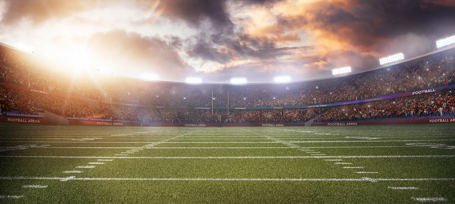 A football field against a dramatic sky